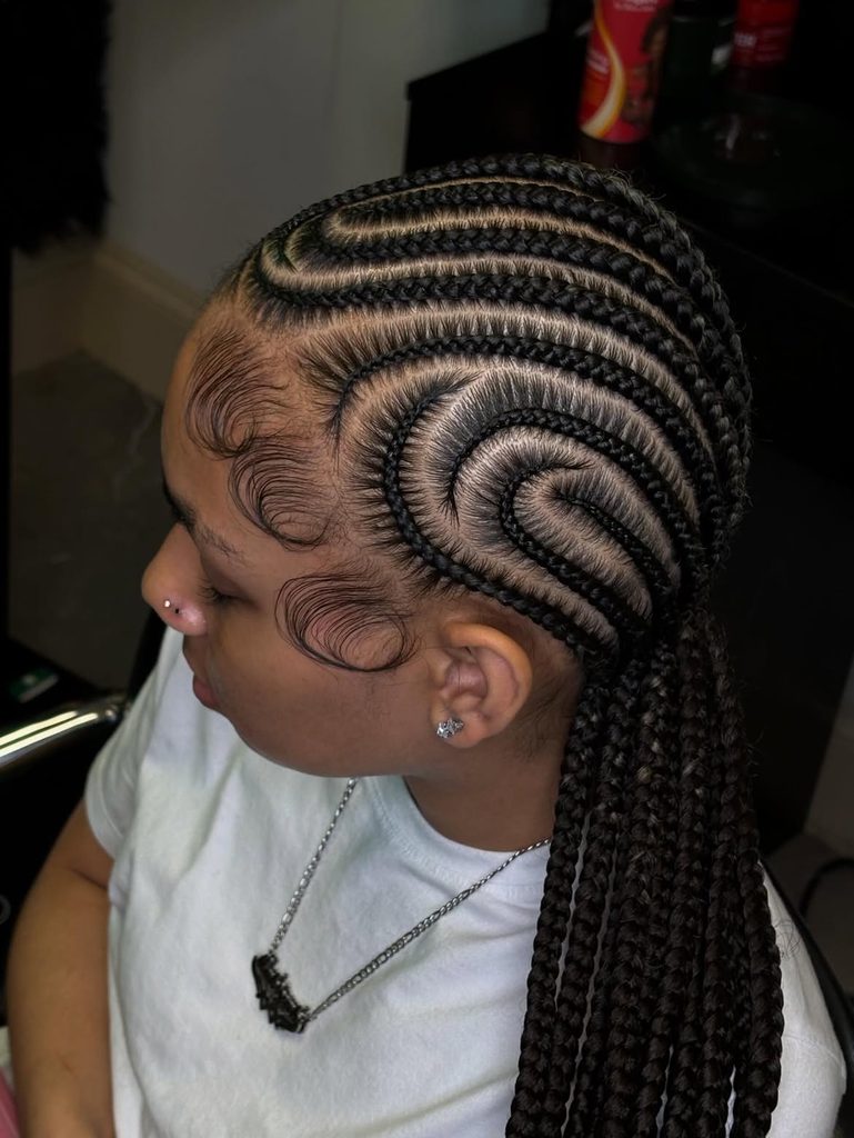 Sleek feed-in cornrows in a creative fall hairstyle