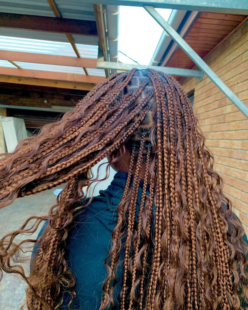 Long goddess braids with loose curly pieces