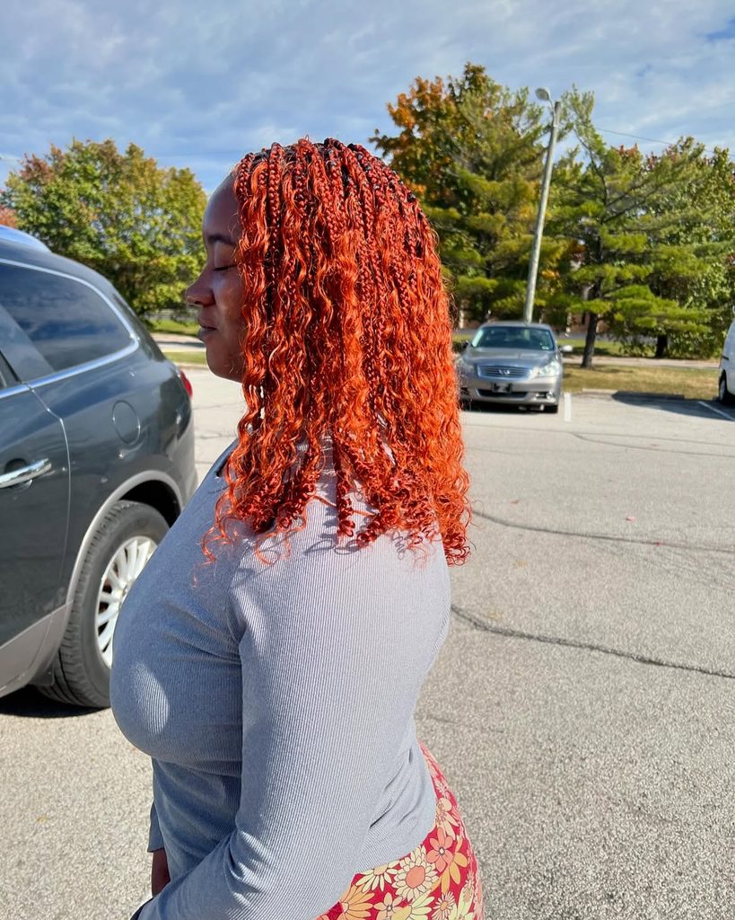 Shoulder-length knotless braids on Black woman