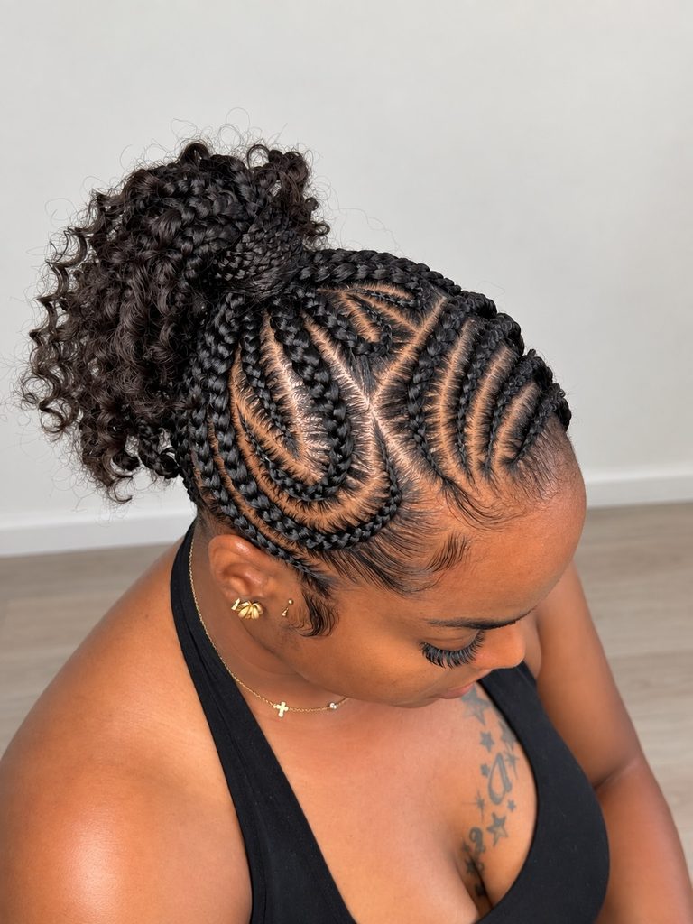Braided ponytail with intricate cornrows and voluminous curly ends