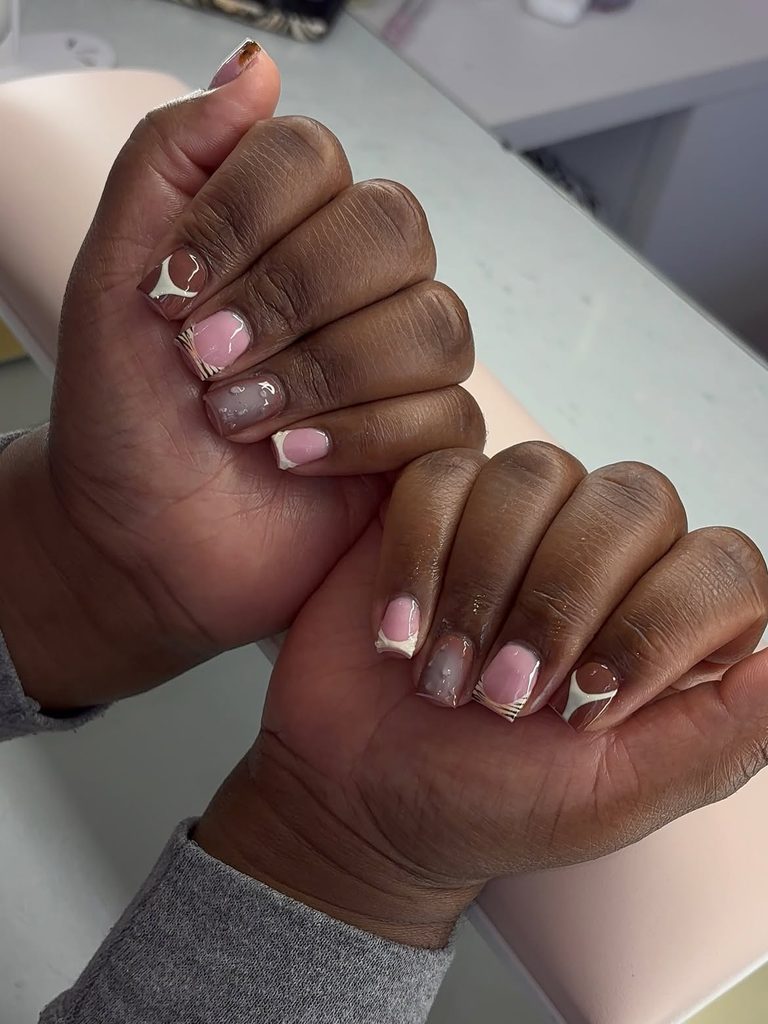 Short square nails with pink nude base, chocolate swoosh, taupe droplet accent, and tortoiseshell tip